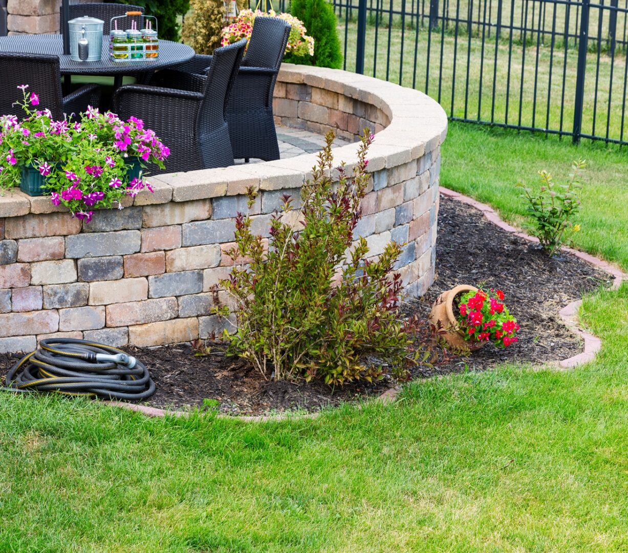 Circular Raised Brick Patio In A Formal Green Lawn